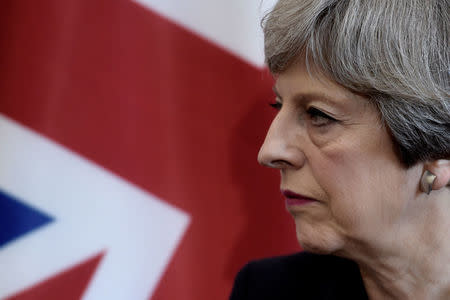 Britain's Prime Minister Theresa May listens to the French President during a bilateral meeting at the G7 Summit in Taormina, Sicily, May 26, 2017. REUTERS/Stephane De Sakutin/Pool