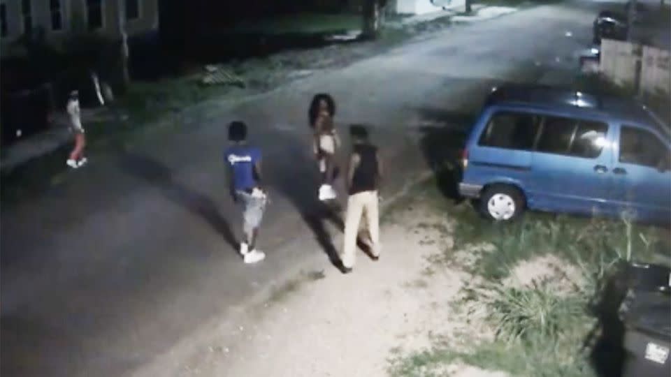 The four thugs are seen lurking through the dark streets of New Orleans. Photo: NOPD