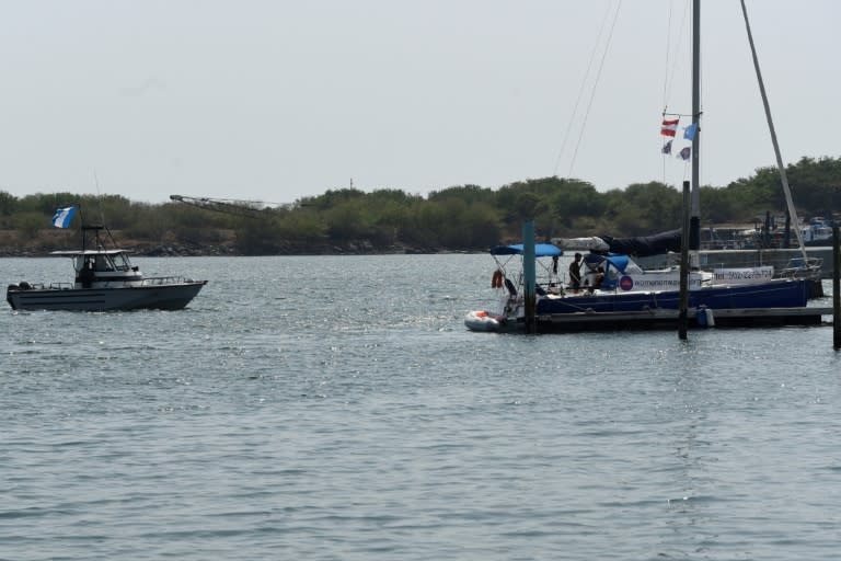 An army boat approaches the "abortion ship" of the Dutch organization Women on Waves at the Pez Vela Marina in the port of San Jose, Escuintla department, 120 km south of Guatemala City, on February 23, 2017