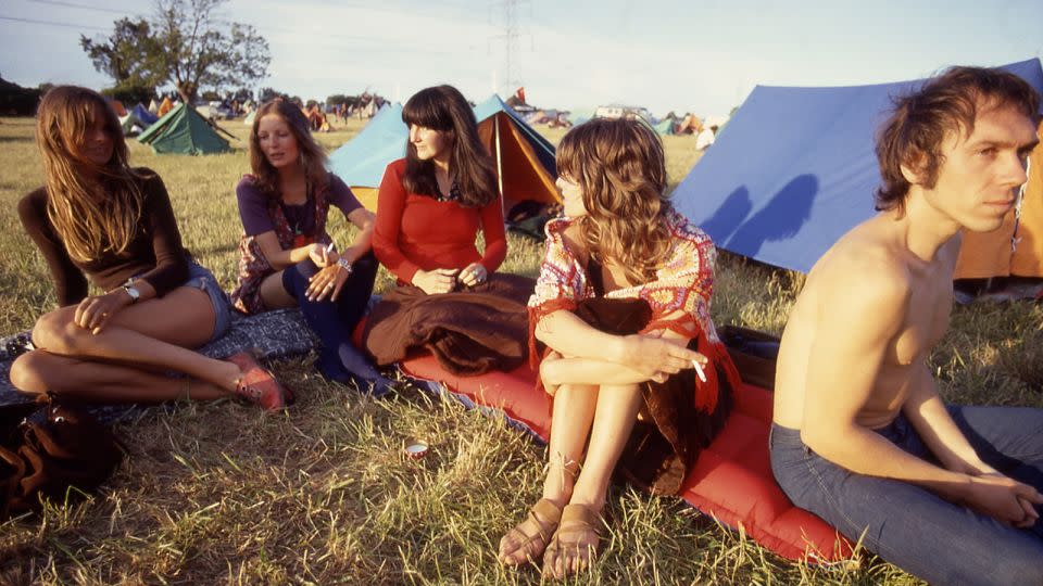On the left, model Jean Shrimpton in a brown top sits with friends including actor Julie Christie, in a crochet shawl. - Paul Misso