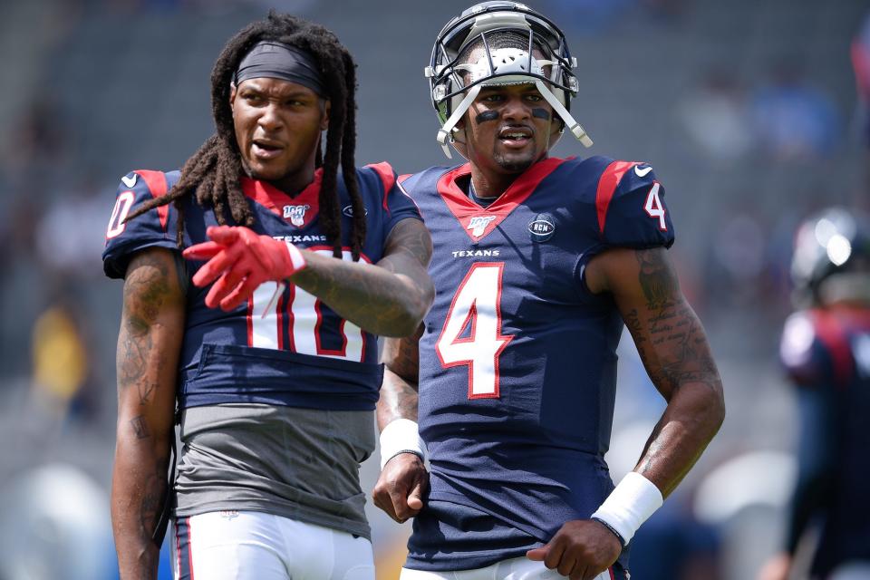 Texans quarterback Deshaun Watson (4) speaks with wide receiver DeAndre Hopkins (10) prior to the game against the Los Angeles Chargers at Dignity Health Sports Park.