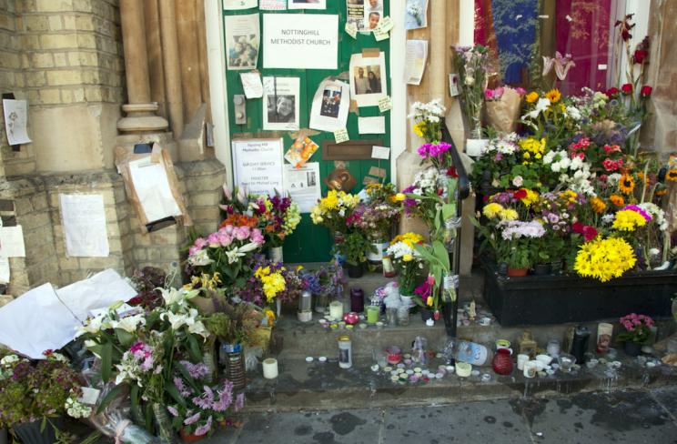 Floral tributes left to victims of the fire (Picture: Rex)