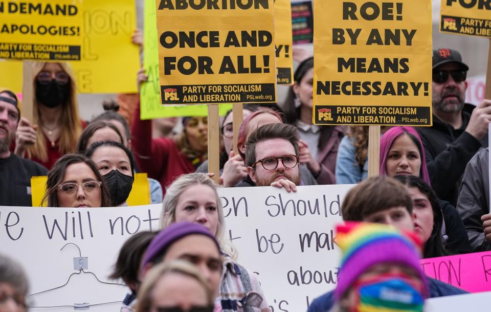 Hoosiers gathered to protest the leaked opinion of the Supreme Court considering overturning the ruling of abortions Tuesday, May 4, 2022, at Monument Circle in Indianapolis.