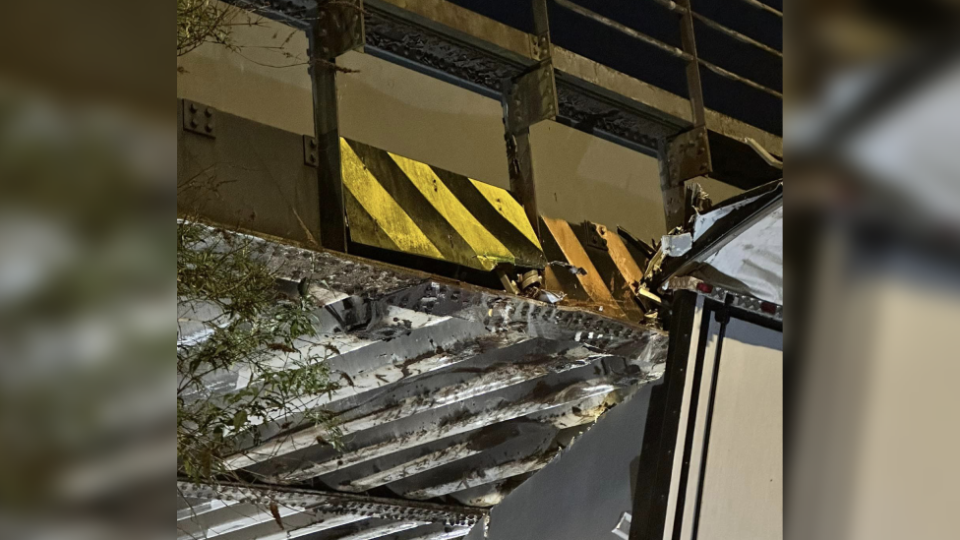 Damage can be seen on both the bridge and roof of the HGV lorry where the crash happened