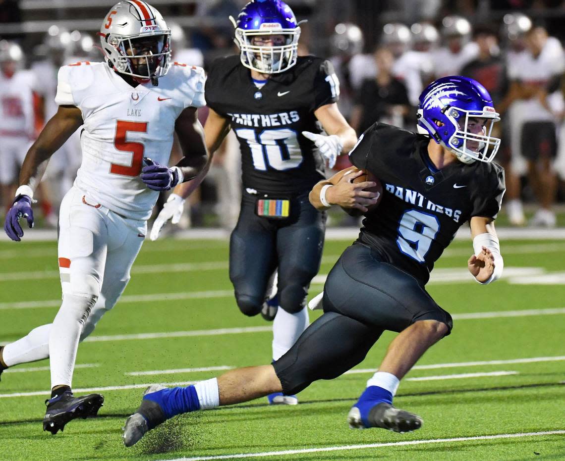 Midlothian quarterback Chad Ragle, right runs past Lake Belton’s Javeon Wilcox. left and teammate Keshawn Baptiste for a first down in the fourth quarter of Friday’s October 21, 2022 District 4-5A Division 1 football game at Midlothian ISD Stadium in Midlothian, Texas. Midlothian won 39-37. Special/Bob Haynes