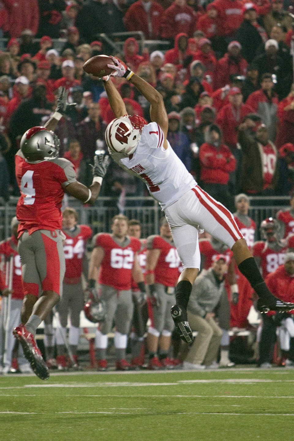 Oct 29, 2011; Columbus, OH, USA; Wisconsin Badgers wide receiver Nick Toon (1) leaps for the ball in the last 15 seconds of the game while covered by Ohio State Buckeyes defensive back C.J. Barnett (4) at Ohio Stadium. He did not make the catch, and Ohio State won the game 33-29. Mandatory Credit: Greg Bartram-USA TODAY Sports