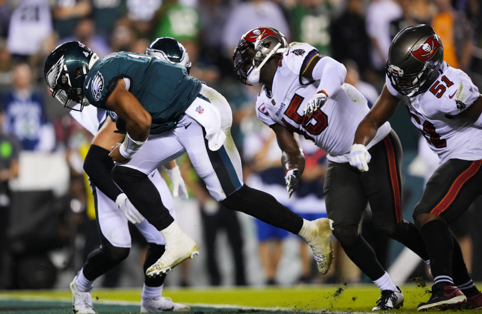 Philadelphia Eagles quarterback Jalen Hurts scores a touchdown during the second half of an NFL football game against the Tampa Bay Buccaneers on Thursday, Oct. 14, 2021, in Philadelphia. (AP Photo/Matt Slocum)