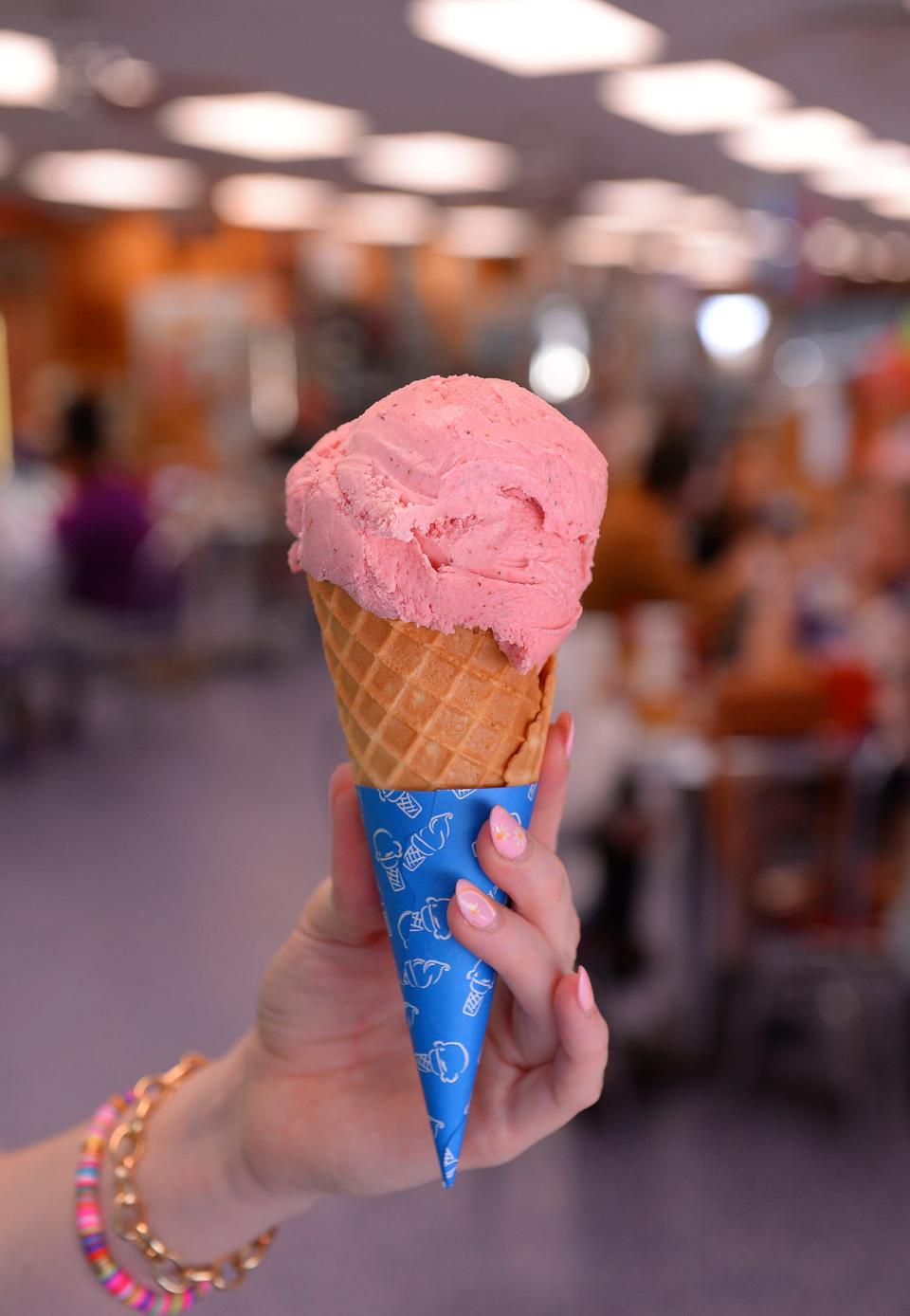 Strawberry season has begun at Strawberry Hill USA in Chesnee. Bailey Philbeck shows a freshly-made Strawberry Ice Cream Cone at the cafe, Monday, May 9, 2022. 