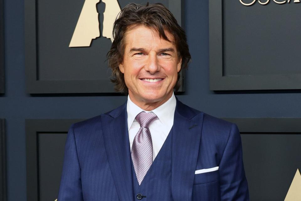 <p>Monica Schipper/WireImage</p> Tom Cruise attends the 95th Annual Oscars Nominees Luncheon on Feb. 13, 2023