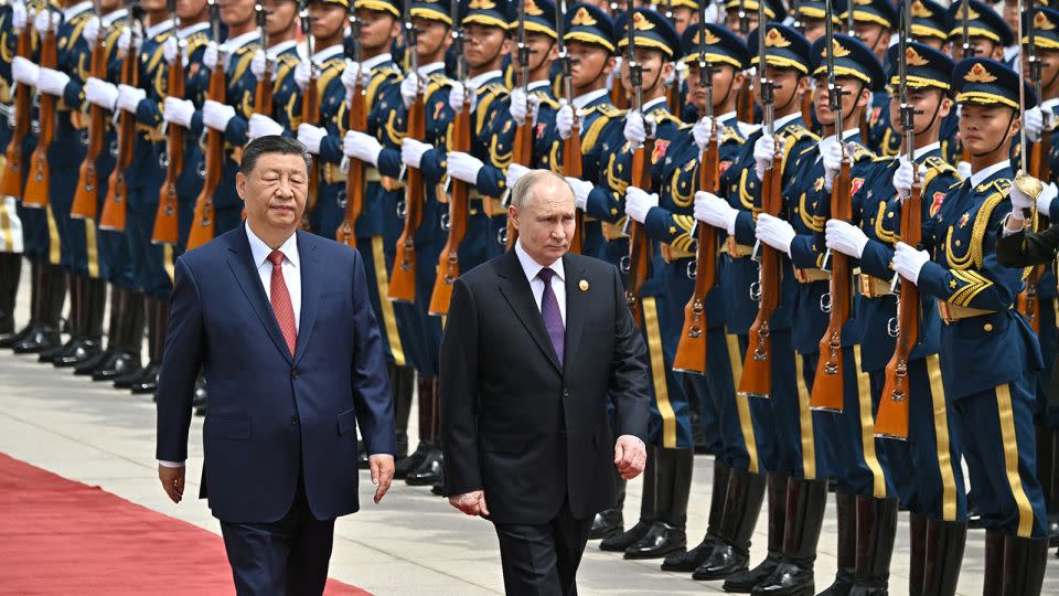 Russia's President Vladimir Putin and China's leader Xi Jinping attend an official welcoming ceremony in front of the Great Hall of the People in Tiananmen Square in Beijing on May 16, 2024. - Sergei Bobylov/Pool/AFP/Getty Images