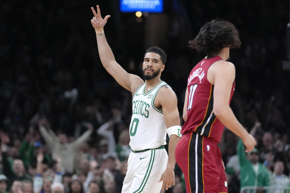 Jayson Tatum's triple double of 23 points, 10 rebounds and 10 assists led the Celtics to a blowout win over the Miami Heat in Game 1 of their first-round playoff series on Sunday in Boston. (AP Foto/Steven Senne)