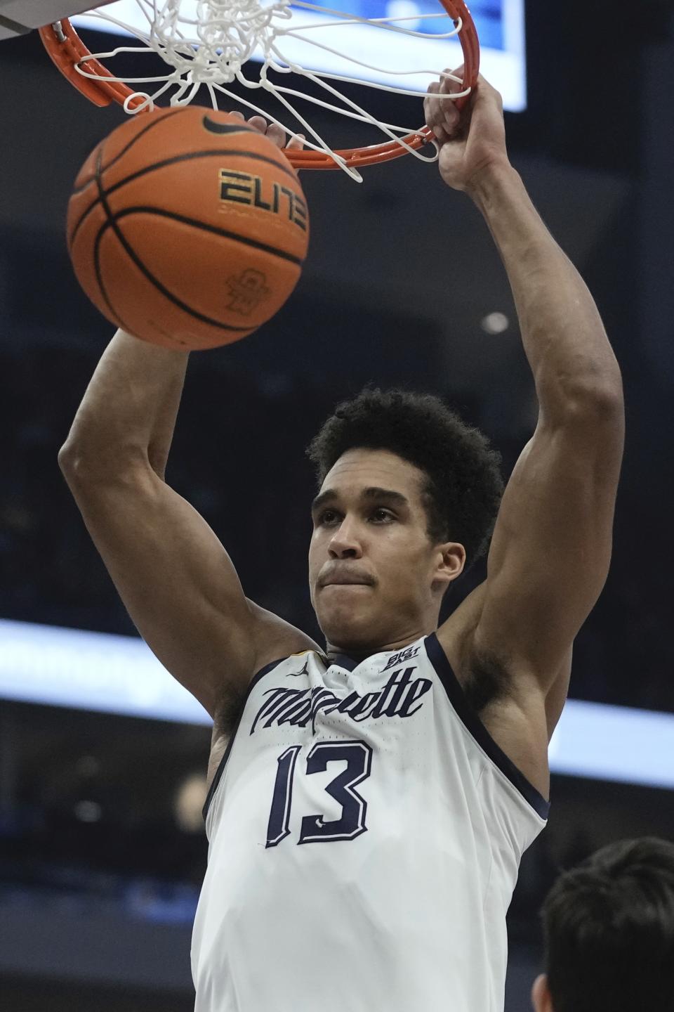 Marquette's Oso Ighodaro dunks during the first half of an NCAA college basketball game Saturday, Jan. 27, 2024, in Milwaukee. (AP Photo/Morry Gash)