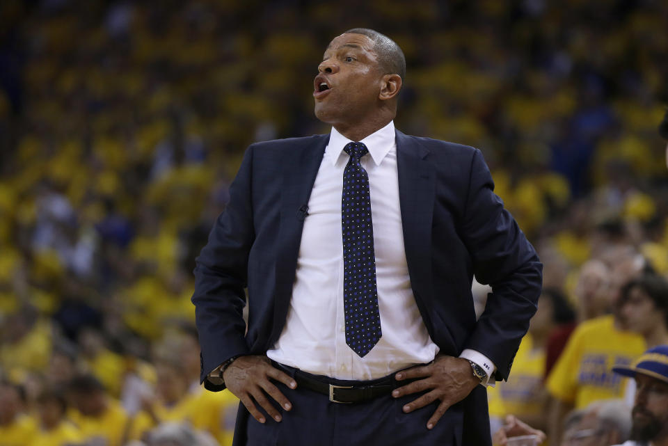 Los Angeles Clippers head coach Doc Rivers talks to his team from the sideline during the first quarter of Game 6 of an opening-round NBA basketball playoff series against the Golden State Warriors in Oakland, Calif., Thursday, May 1, 2014. (AP Photo/Marcio Jose Sanchez)