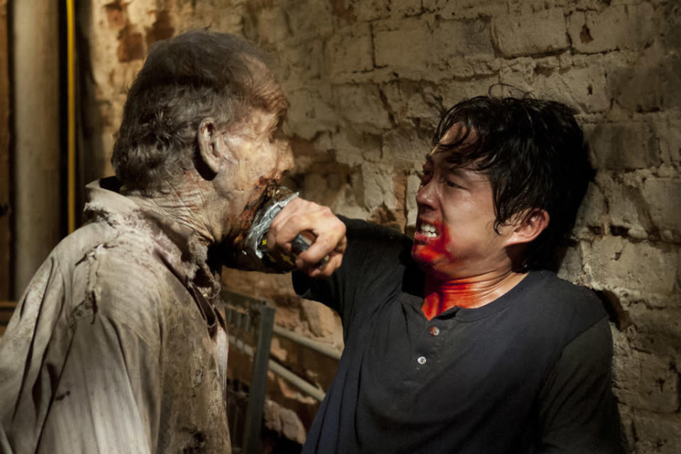 Glenn (Steven Yeun) and a walker in "The Walking Dead" episode, "When the Dead Come Knocking."