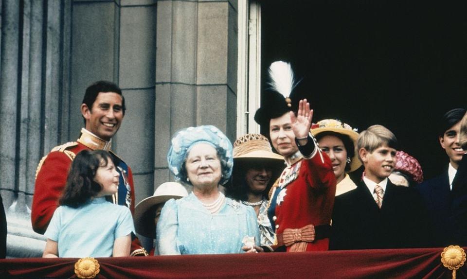 <p>A young Queen Elizabeth waves to spectators.</p>