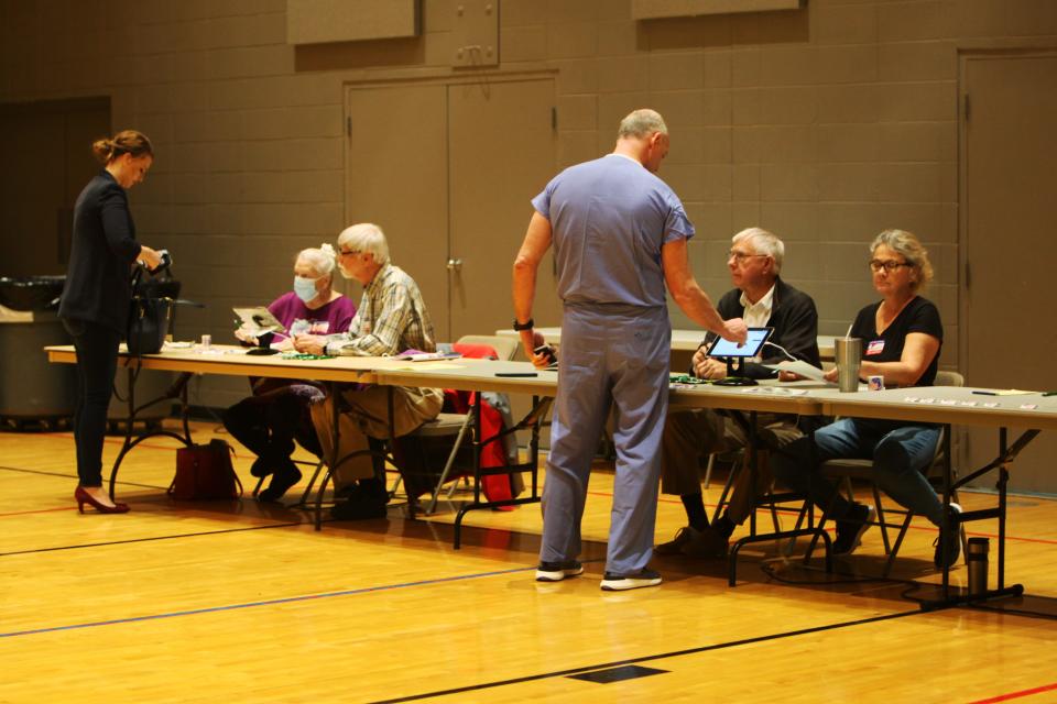 Voters arrive at a Springfield polling place on April 5, 2022. House Bill 1878, signed into law Wednesday by Gov. Mike Parson, requires photo ID to vote, allows for two weeks of early in-person voting without needing an excuse, bans drop boxes for absentee ballots, allows the Secretary of State to audit voter rolls, bans private donations to election authorities and eliminates Missouri's presidential preference primary.