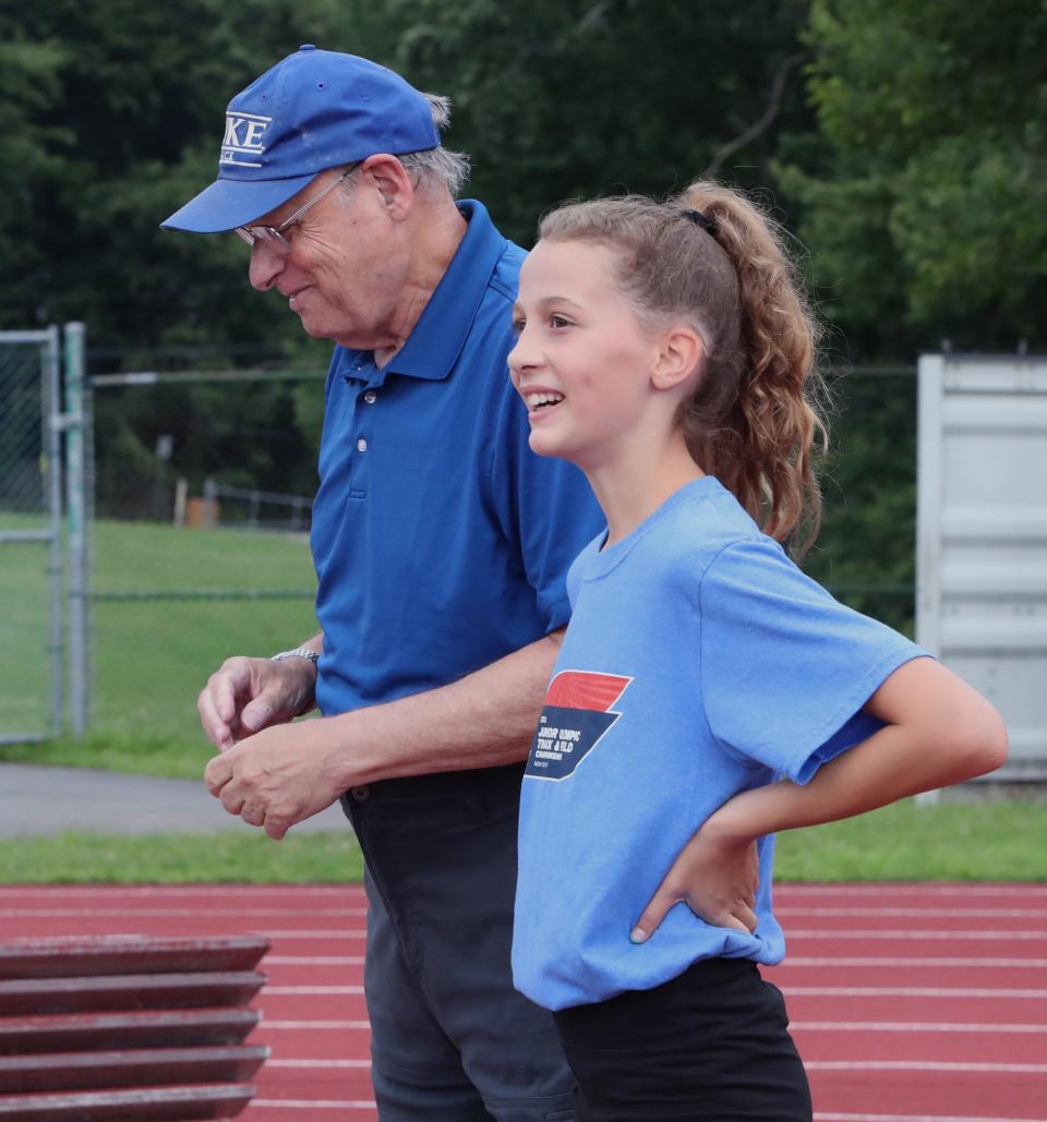 Longtime Rockland volunteer track coach Don Schlesinger, works with Sunny Prinz, 10, of New City at Clarkstown South High School July 20, 2023. Prinz will be competing in the national Junior Olympics.