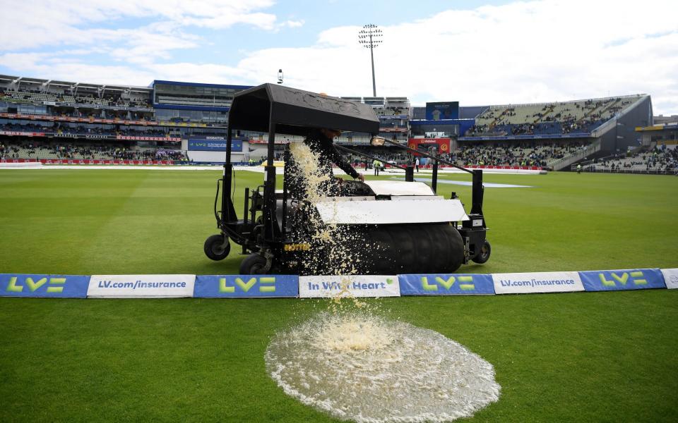 Water is cleared off the pitch - Alex Davidson/Getty Images