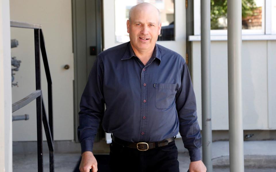 James Oler leaves the court house after a Canadian judge found the former member of a breakaway religious sect guilty of practicing polygamy, in Cranbrook - Credit: Reuters