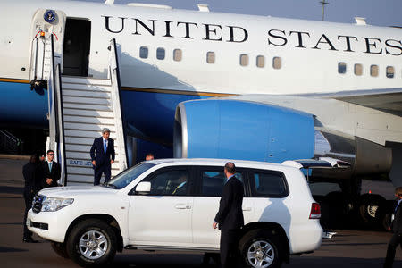 U.S. Secretary of State John Kerry leaves his plane as he arrives at Kigali international airport in Rwanda capital to promote U.S. climate and environmental goals at the Meeting of the Parties to the Montreal Protocol on the elimination of hydro fluorocarbons (HFCs) use, October 13, 2016. REUTERS/James Akena