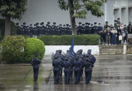 Hong Kong police match on the National Security Education Day at a police school in Hong Kong Thursday, April 15, 2021. Beijing's top official in Hong Kong on Thursday warned foreign forces not to interfere with the "bottom line" of national security in Hong Kong, threatening retaliation even amid ongoing tensions between China and Western powers.(AP Photo/Vincent Yu)