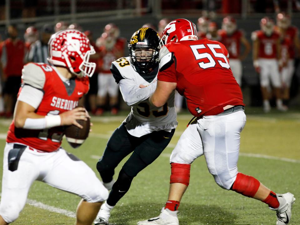 Tri-Valley defensive end Chris Gargasz tries to put a rush on Sheridan's Caden Sheridan during the fourth quarter of the Scotties' 28-17 win on Oct. 13, 2023, at Paul Culver Jr. Stadium. Gargasz's pass rushing helped hold the Generals to 7-of-22 passing for 77 yards.