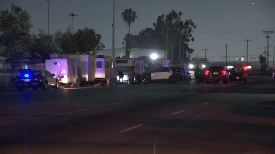 LAPD officers investigate a shooting near East Washington Boulevard and South Alameda Street. Multiple people were struck by gunfire on May 11, 2024. (KTLA)
