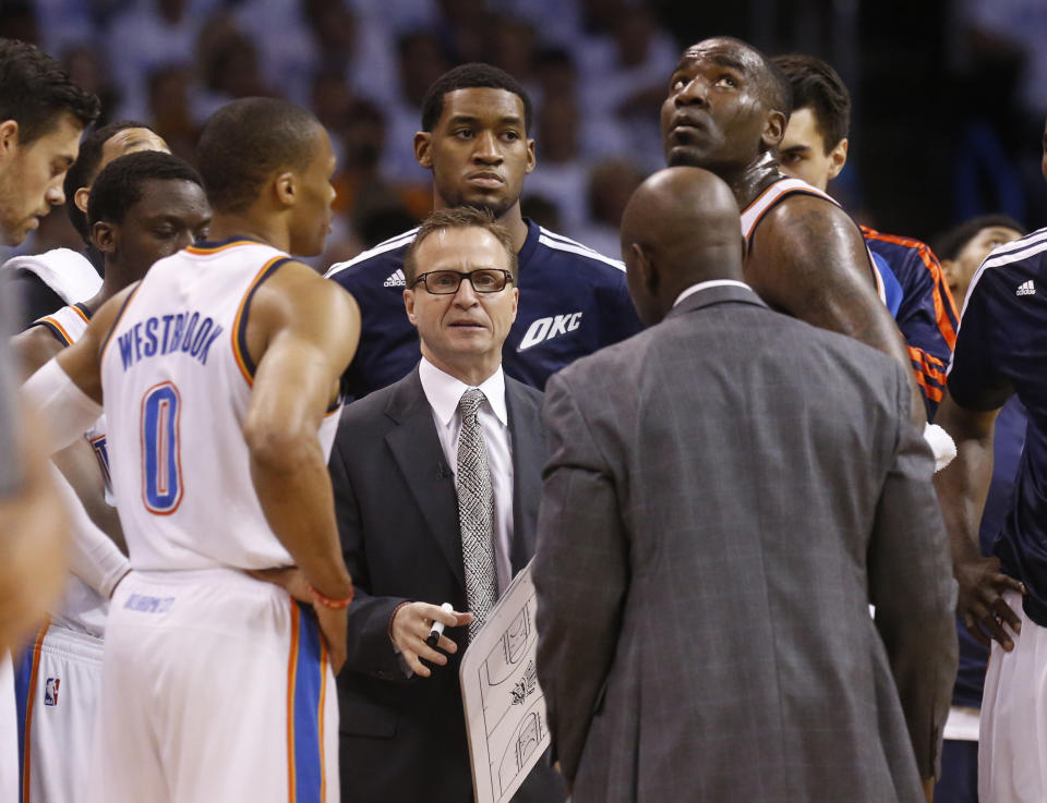 Oklahoma City Thunder coach Scott Brooks talks to his team in the first quarter of Game 5 of the Western Conference semifinal NBA basketball playoff series against the Los Angeles Clippers, in Oklahoma City on Tuesday, May 13, 2014. (AP Photo)