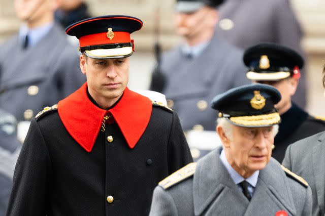 <p>Samir Hussein/WireImage</p> Prince William and King Charles during the National Service of Remembrance at The Cenotaph on November 12, 2023 in London.