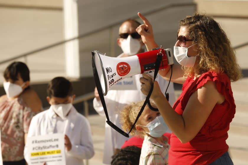 LOS ANGELES, CA - JULY 07: Pilar Schiavo, right, co-founder of West Valley People's Alliance joined the group as they gathered in front of Los Angeles federal courthouse while former Los Angeles City Councilman Mitchell Englander was inside where he entered a guilty plea to a single felony charge in the ongoing corruption probe of City Hall, admitting he schemed to prevent federal investigators from learning about cash and other freebies he received from a Southern California businessman. Federal Courthouse on Tuesday, July 7, 2020 in Los Angeles, CA. (Al Seib / Los Angeles Times)