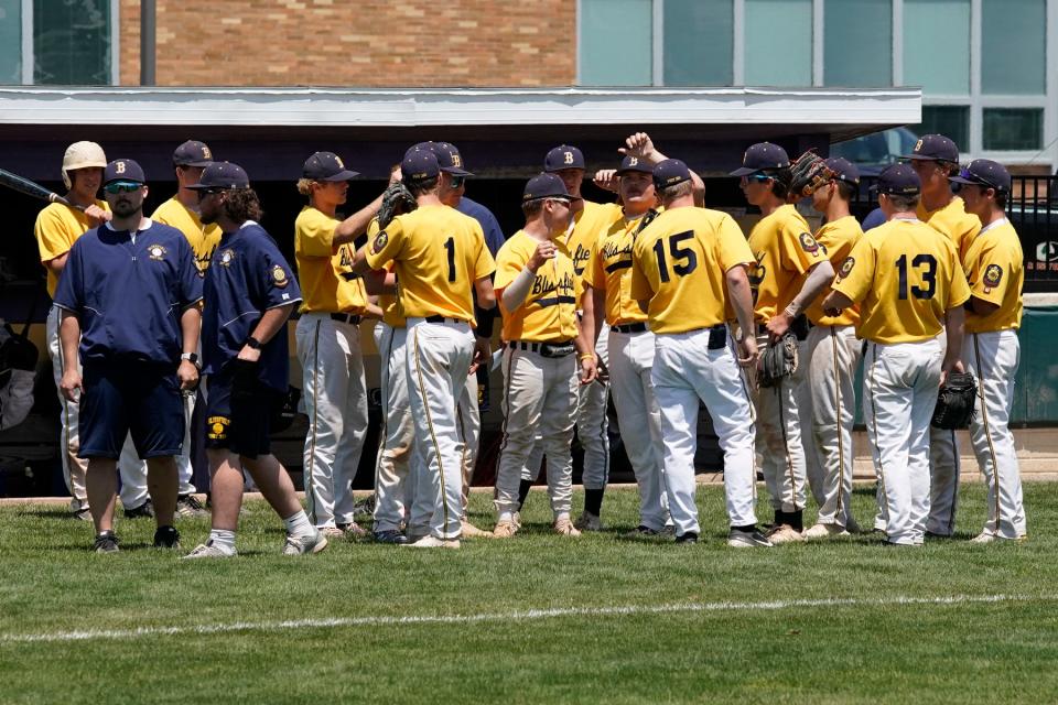 The Blissfield Post 325 American Legion baseball team prepares to take the field for the championship game Sunday against the Toledo Hawks.