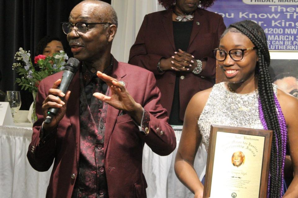 So'Unique High, right, a senior at P.K. Yonge Developmental and Research School, received a total of $16,335 as the recipient of the 2023 Joel Buchanan Drum Major for Justice Scholarship Award sponsored by the Martin Luther King Jr. Commission of Florida Inc. To her left is Rodney Long, president and founder of the King Commission.
(Photo: Photo by Voleer Thomas/For The Guardian)