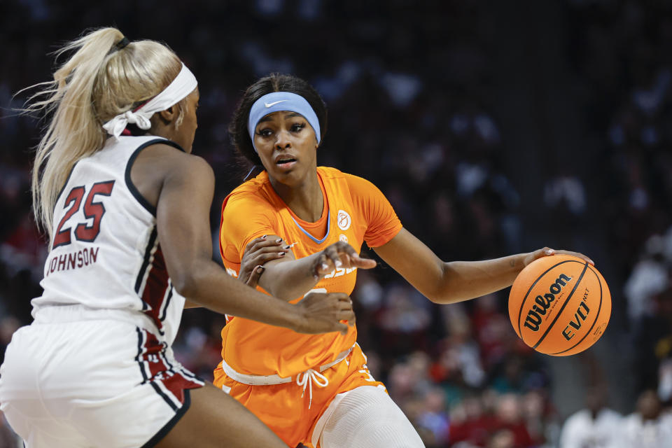 Tennessee forward Rickea Jackson, right, drives against South Carolina guard Raven Johnson (25) during the second half of an NCAA college basketball game in Columbia, S.C., Sunday, March 3, 2024. (AP Photo/Nell Redmond)