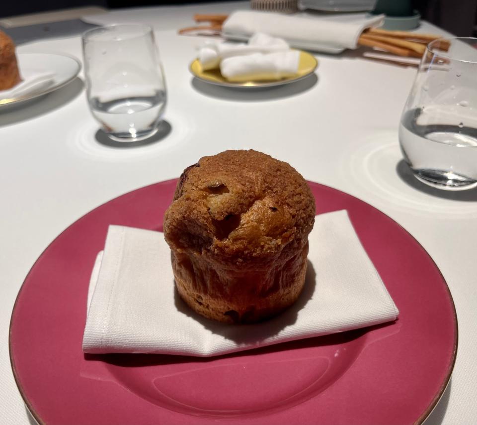 The Panetonne course at  Osteria Francescana on a red plate