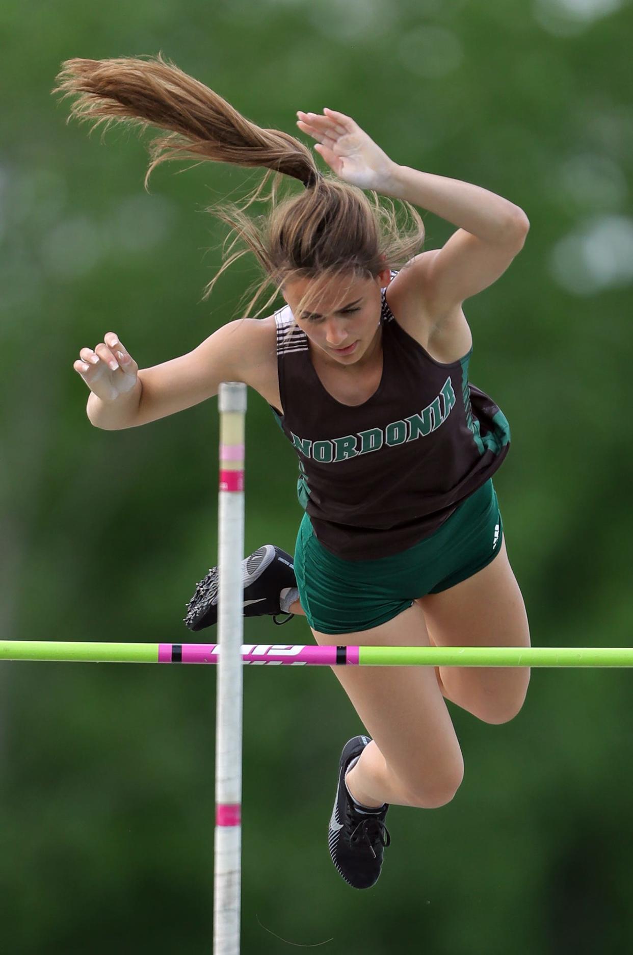 Nordonia's Emily Eterovich clears a bar set at 11' 4" to win the girls pole vault event during the Division I district track meet at Nordonia High School on Friday.