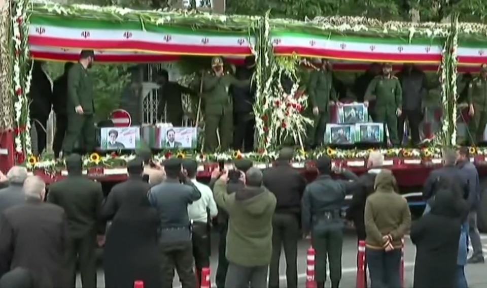 Coffins of the Iranian President and seven members of his entourage are seen on a truck during the funerary procession (IRAN PRESS/AFP via Getty Images)