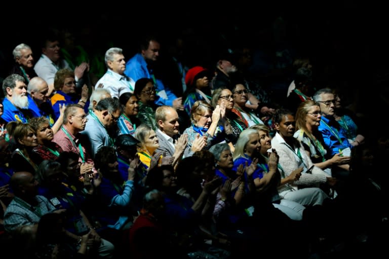 Members of the public applaud at the national apology for child sex abuse victims