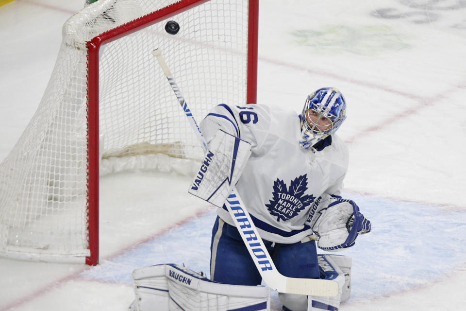 Toronto Maple Leafs goaltender Jack Campbell deflects a shot by the Minnesota Wild during the first period of an NHL hockey game, Saturday, Dec. 4, 2021, in St. Paul, Minn. (AP Photo/Andy Clayton-King)