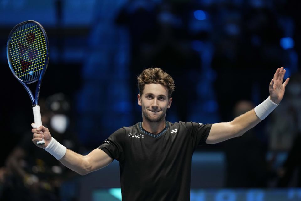 Norways' Casper Ruud celebrates after defeating Britain's Cameron Norrie during their ATP World Tour Finals singles tennis match, at the Pala Alpitour in Turin, Wednesday, Nov. 17, 2021. (AP Photo/Luca Bruno)