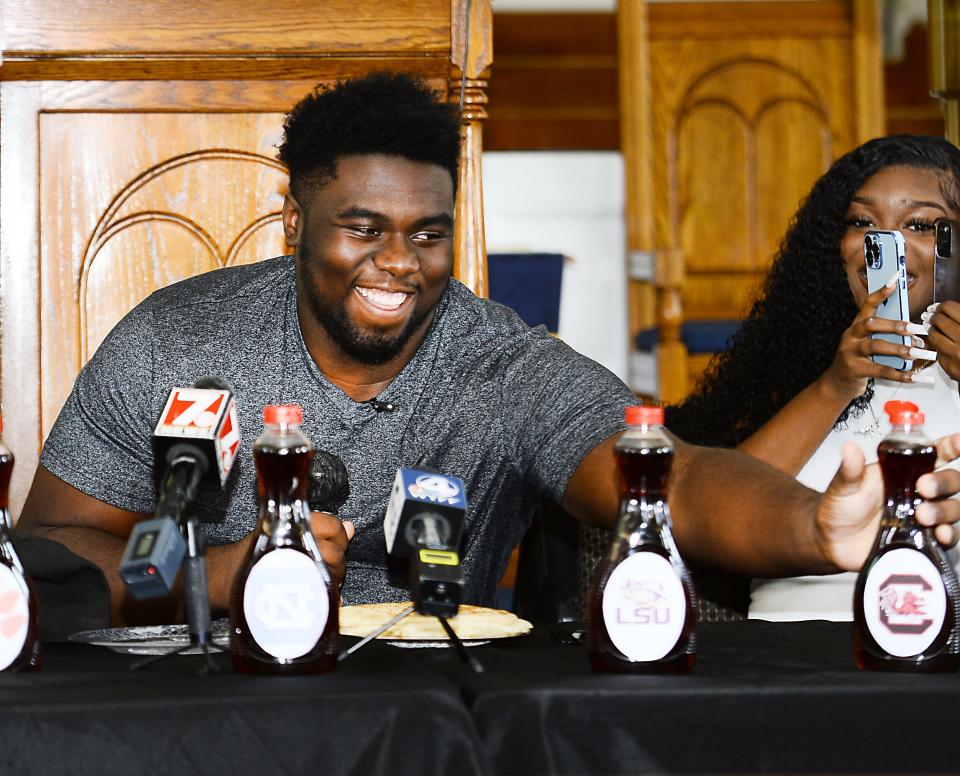 Markee Anderson announced his commitment to play college football at USC. The Dorman offensive lineman made his announcement at Kingdom Builders Baptist Church in Spartanburg on July 31, 2022. Here he reaches for a bottle of syrup with a USC sticker on it for his choice in schools. 