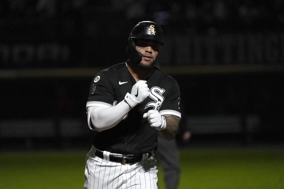 Chicago White Sox's Yoan Moncada celebrates while running the bases on a home run off Los Angeles Angels starting pitcher Janson Junk as the stadium lights flicker in a strobe-light fashion during the fourth inning of a baseball game Wednesday, Sept. 15, 2021, in Chicago. (AP Photo/Charles Rex Arbogast)