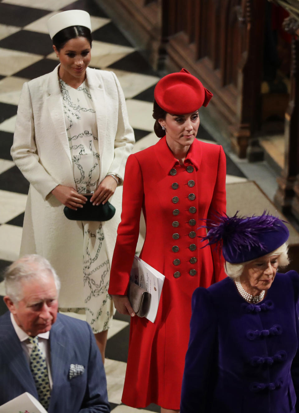 FILE - In this March 11, 2019 file photo, Britain's Kate, Duchess of Cambridge and Meghan, Duchess of Sussex leave after attending the Commonwealth Service at Westminster Abbey in London. With another royal baby on the horizon, the debate over postpartum perfection is alive and well. As it stands, we don’t know whether Meghan Markle will follow in the footsteps of Kate Middleton when it comes to that magical perfection, but we have an inkling she’ll at least slap on some makeup when she introduces the latest royal to the world next month. (AP Photo/Kirsty Wigglesworth, Pool)