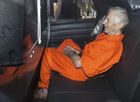 Robert Durst sits in a police vehicle as he leaves a courthouse in New Orleans, Louisiana March 17, 2015. REUTERS/Lee Celano
