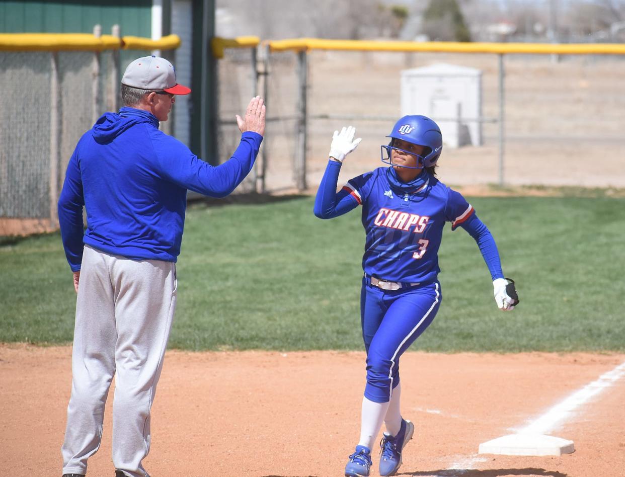 Lubbock Christian University coach Daren Hays, left, congratulates Kamryn Gibbs after a home run. Gibbs is one of four returning position-player starters for the Lady Chaps, who open the season with five home games from Friday through Sunday in the Lubbock Sports College Classic.