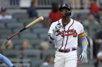 Atlanta Braves' Ronald Acuna Jr. tosses his bat after walking on pitches from St. Louis Cardinals pitcher Kwang Hyun Kim in the first inning of the second baseball game of a doubleheader Sunday, June 20, 2021, in Atlanta. (AP Photo/Ben Margot)