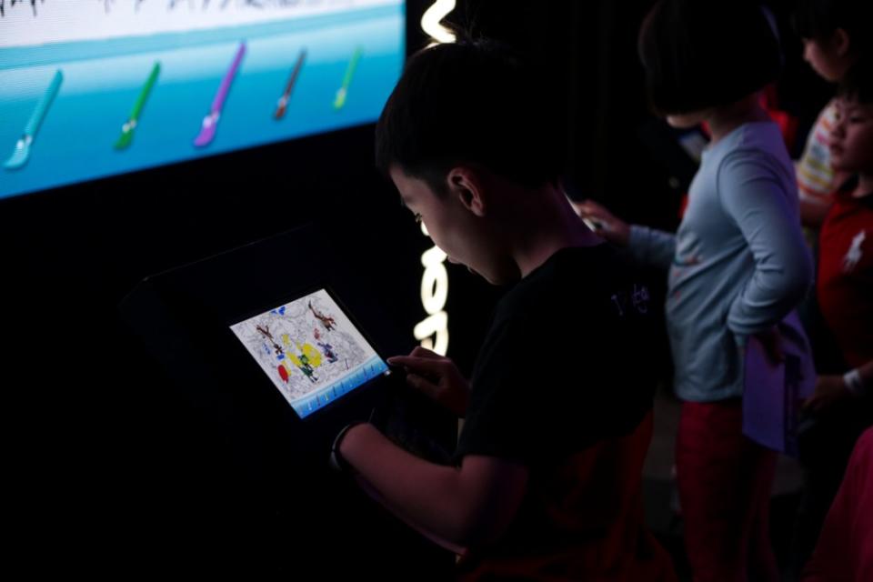 The illuminated forest at the Pavilion offers children various fun activates, including digital colouring workshop. ― Picture by Ahmad Zamzahuri