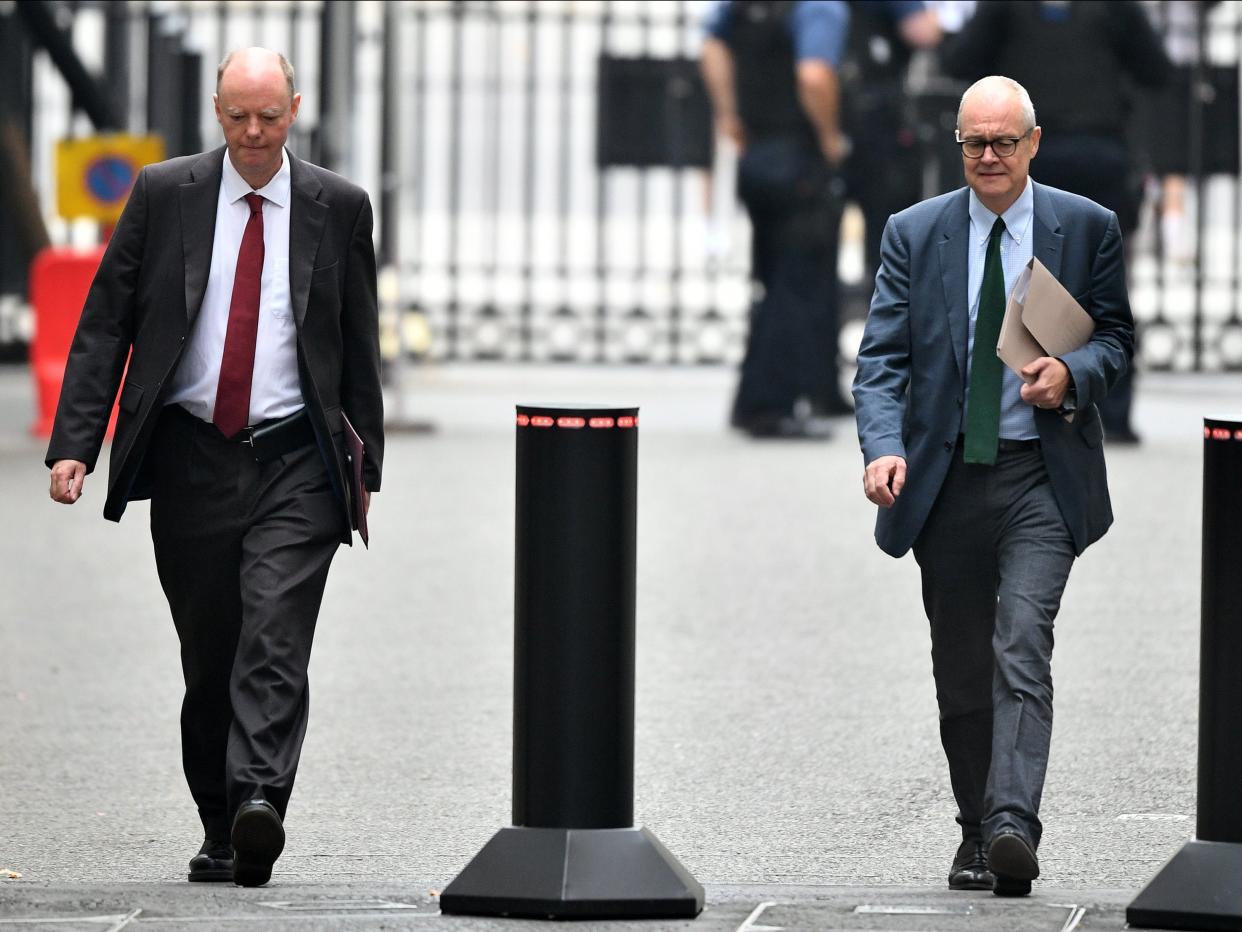 Chief medical officer for England Chris Whitty and chief scientific adviser Sir Patrick Vallance arrive at Downing Street, 21 September 2020.  (Leon Neal/Getty Images)