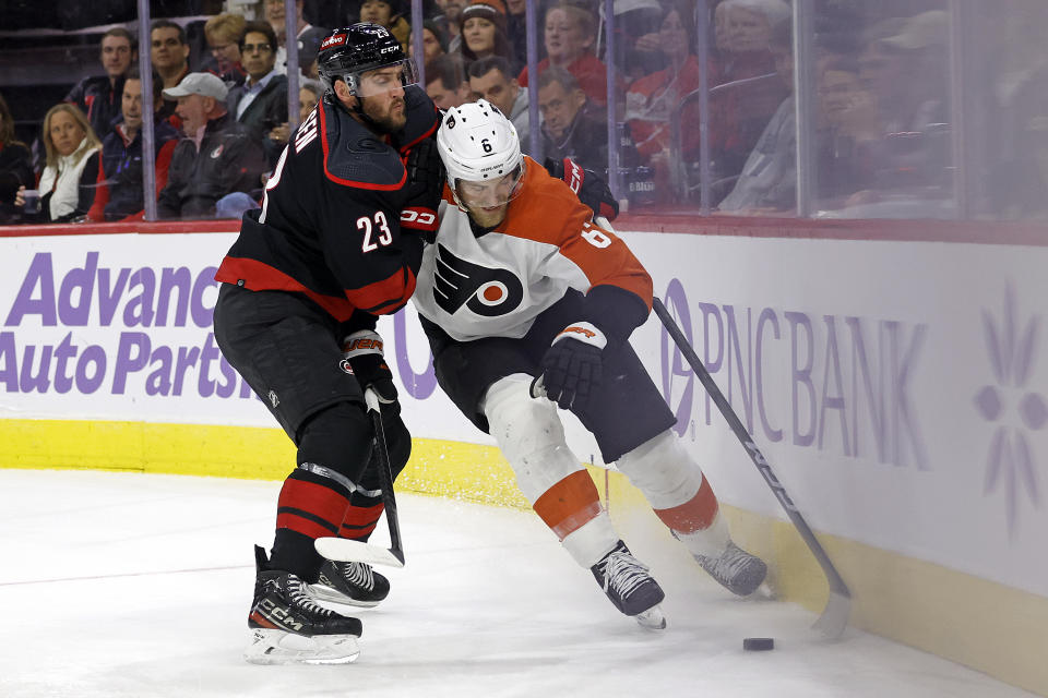 Carolina Hurricanes' Stefan Noesen (23) works against Philadelphia Flyers' Travis Sanheim (6) during the second period of an NHL hockey game in Raleigh, N.C., Wednesday, Nov. 15, 2023. (AP Photo/Karl B DeBlaker)