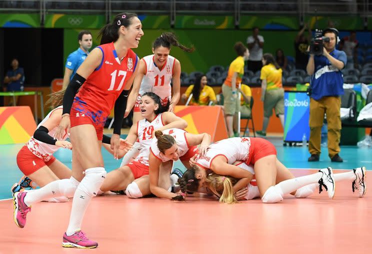 Serbia's players react after winning the women's semi-final volleyball match against USA at the Maracanazinho stadium in Rio de Janeiro on August 18, 2016, during the Rio 2016 Olympic Games. / AFP / Eric FEFERBERG (Photo credit should read ERIC FEFERBERG/AFP/Getty Images)