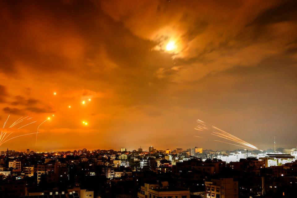 Rockets fired by Palestinian militants from Gaza City are intercepted by the Israeli Iron Dome (AFP via Getty Images)